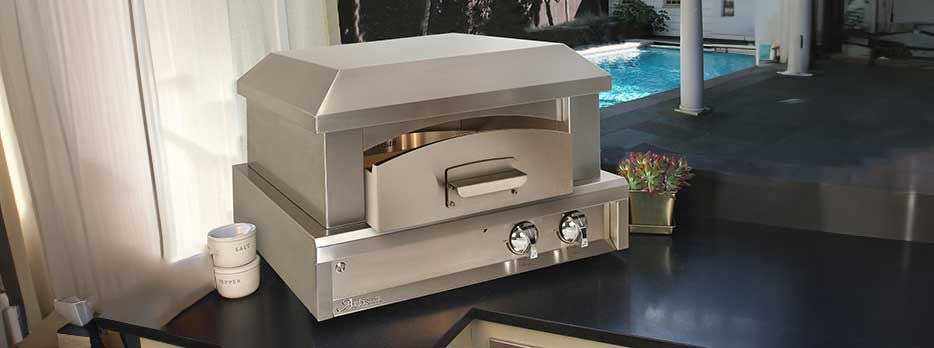 Artisan Outdoor Oven on a countertop near a pool setting